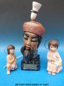 A table lamp formed as a Persian head and two angel ornaments