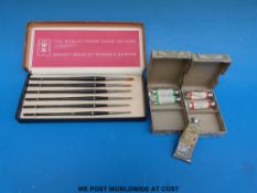 A boxed set of Winsor & Newton sable brushes, two boxes of Winsor & Newton watercolour tubes,