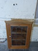 A glazed pine hanging corner cupboard (H86cm)