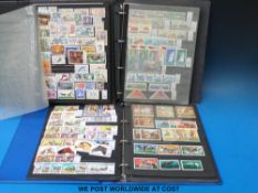 Three ring binders of themed stamp collections