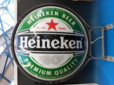 A double sided Heineken advertising sign with internal light (82cm diameter)