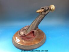 A pair of 19thC wall mounted blackamoor style light fittings formed as hands holding brass candle