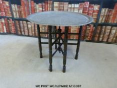 Oriental brass topped folding table (Diameter 58cm)