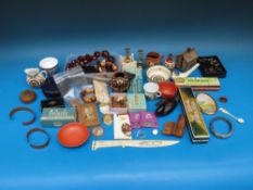 A quantity of collectables to include harmonicas, cast house money box,