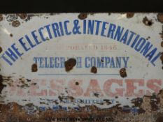An enamel sign 'The Electric and International Telegraph Company' with further text regarding the