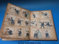A vintage scrap album containing late 19thC comic strips with hand written text dated 1879 plus