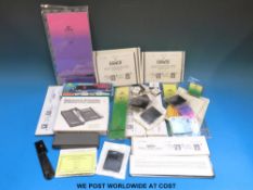 A tin of stamp accessories