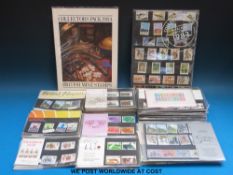 Approximately ninety GB presentation packs in a box file together with nine annual collectors packs