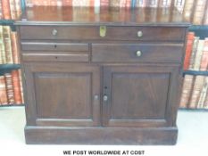 An unusual 19thC mahogany cabinet with lift-up lid,