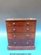 An apprentice chest of small collectables including Nazi badges