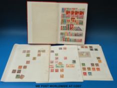 A collection of Chinese stamps on loose album pages 1885 - 1960's together with a stock book of