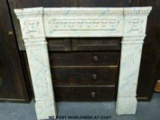A neoclassical style cast iron fire surround