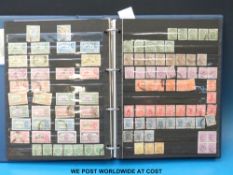 A stock book of India States mint and used Victoria - George VI.