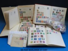 Two boxes of world stamps in albums,
