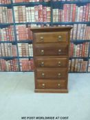 A narrow chest of five drawers (W49 x D56 x H88cm)