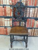A 19thC carved oak hall chair