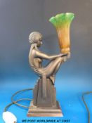 An Art Deco style lamp in the form of a nude lady