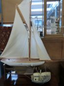 Two decorative model boats, one made from tin cans signed M.J.