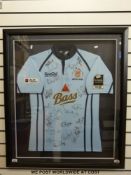 An autographed Bristol Rugby shirt signed by 20 players, framed and glazed.