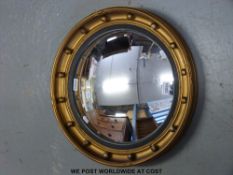 A convex butler's mirror with beaded edge (overall diameter 47cm)