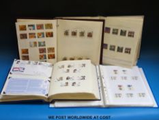 Four albums of modern GB stamps 1977-2000, mint and used.
