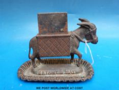 A Bryant & May cast iron donkey match striker or table vesta marked to underside Rd 22410 (length