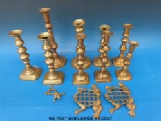 A quantity of brass ejector candle sticks,