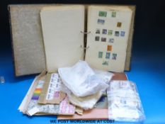 A ring binder of Commonwealth stamps and a large quantity of loose stamps