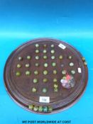 A large Solitaire board complete with marbles