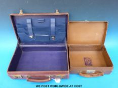 A leather writing case with fitted interior and a small case