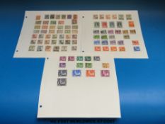 A collection of Dutch stamps on loose album sheets