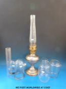 A quantity of oil lamps and parts