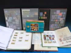 A box of Channel Islands and Isle of Man stamps including presentation packs, stock books,