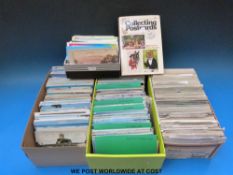 Four boxes of postcards and postcard book