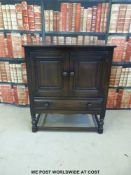 A small Ercol dresser with cupboard above drawer (W79 x D44 x H88cm)