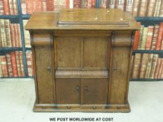 An oak cased treadle sewing machine