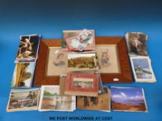 A collection of various postcards and two framed and signed watercolours