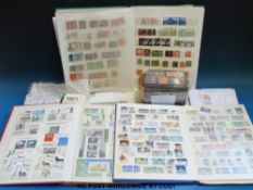 A box of German stamps in stock books and loose stamps