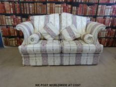 A two seat sofa with scroll arms