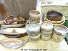 A large collection of turned wooden bowls and serving dishes,