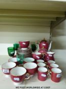 A Wedgwood red and gilt tea and coffee set and four glasses