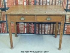A two-drawer pine table or desk (W107 x D60 x H76cm)