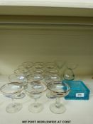 A quantity of Babycham glasses comprising twelve with the Babycham chamois a 'cocktail' engraved