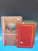 Approximately 200 Edwardian onwards postcards in a vintage album,