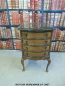 A small bow front bedside chest of four drawers (W46 x D40 x H80cm)