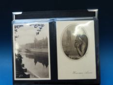 An album of French postcards, early to mid 20thC, approximately 200 including Paris,