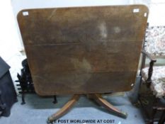 An oak tilt top table (102 x 84 x 70cm)