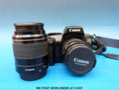 A Canon E0S 1000F SLR camera with two lenses