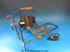 A iron and brass trivet,