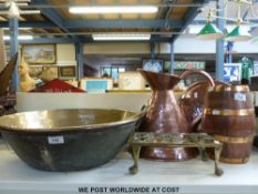A quantity of large copper and brass items to include a two-handled bowl, copper jug, warming pan,